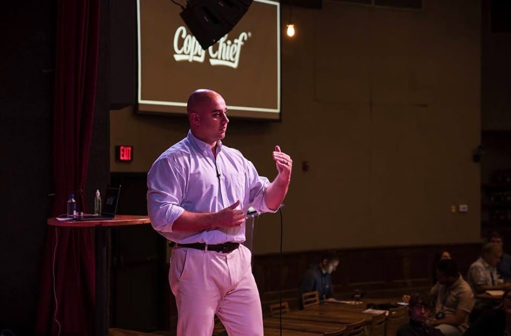 Chris Orzechowski speaking on stage